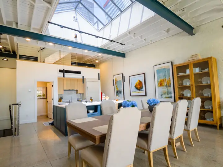 Penthouse dining area beneath skylights