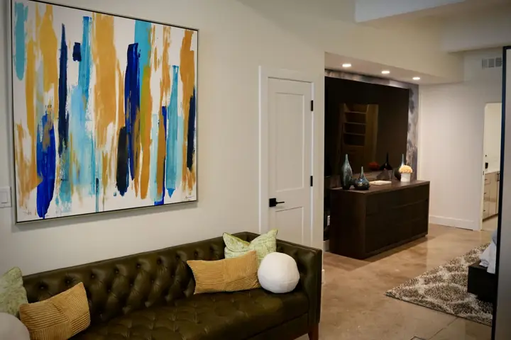 Leather sofa and abstract artwork